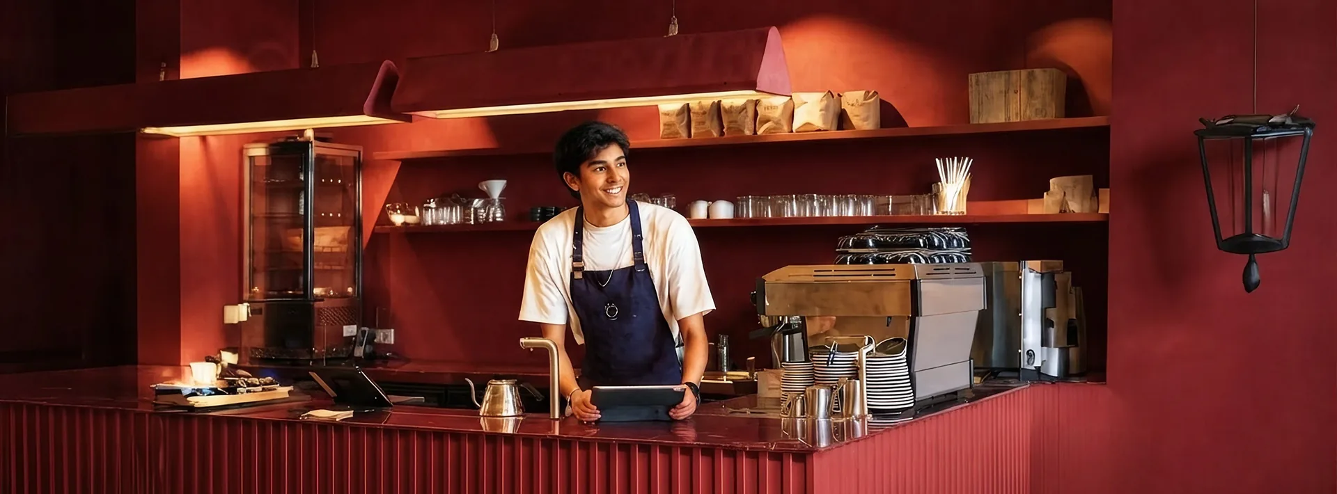 Barista at the counter with a Dotpe tablet
